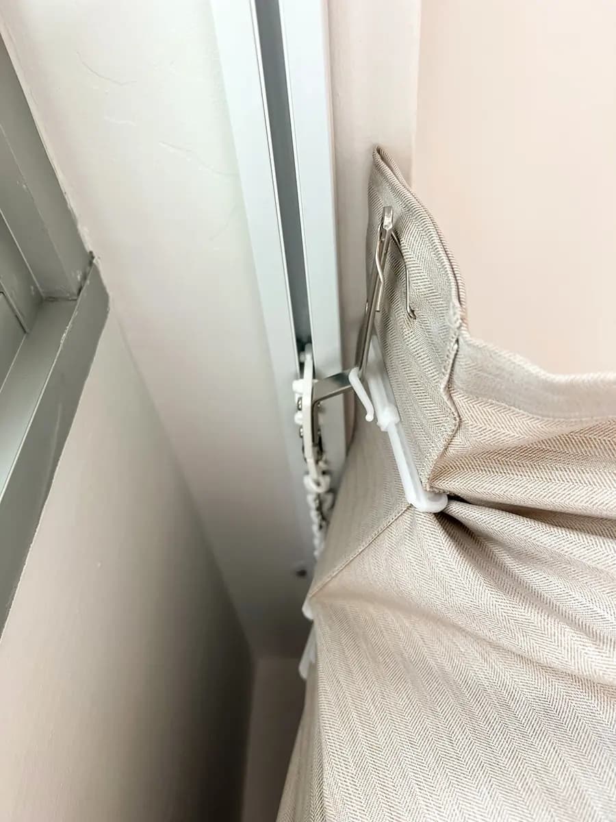 Close view of a motorised curtain track and carrier